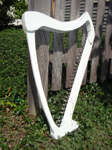 Electric Chromatic Harp, leaning on a fence